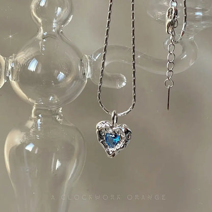 Deepsea Heart Necklace-Sterling Silver Blue Textured Heart Pendant with Center Blue Diamond Simulant，Irregular Design