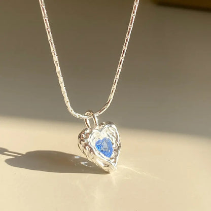 Deepsea Heart Necklace-Sterling Silver Blue Textured Heart Pendant with Center Blue Diamond Simulant，Irregular Design